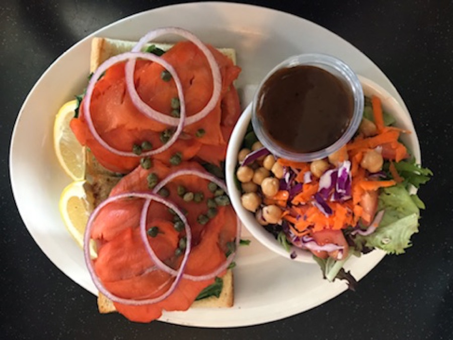 Seafood toast topped with tomatoes and onions.